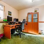 Home office with desk and computer setup.