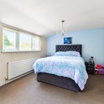Cosy bedroom with double bed and chandelier