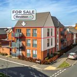 Modern apartment building for sale in residential area.