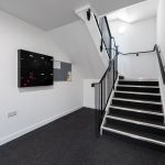 Staircase and hallway in residential building.