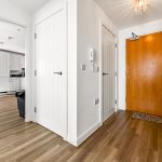 Modern hallway with wooden floors and doors