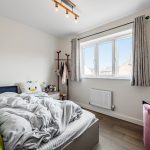 Cosy bedroom with a neatly made bed.