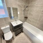 Modern bathroom with bathtub and tiles