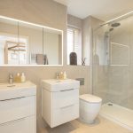 Modern bathroom with shower and double sinks