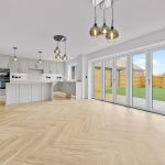 Modern kitchen with large patio doors and island