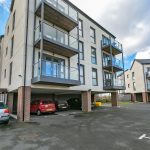 Modern flats with parking and balconies.