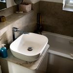 Modern bathroom sink with soap dispenser