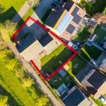 Aerial view of house with red boundary line.