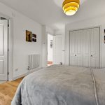 Cosy bedroom with ensuite bathroom and wardrobe.