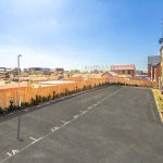 Empty car park near housing construction site.