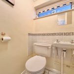 Small bathroom with toilet and sink.
