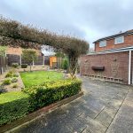 Spacious garden with patio and shed