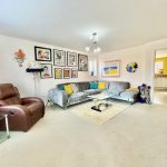 Modern living room with sofa and artwork.
