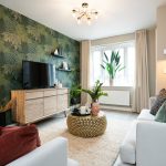 Modern living room with plants and cosy decor.
