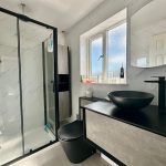 Contemporary bathroom with shower and modern basin.