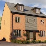 Modern three-storey brick house with driveway