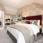 Elegant bedroom with red headboard and decorative lamps.