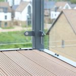 Glass balcony railing with wooden decking