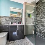 Modern bathroom with shower and stylish design