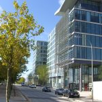 Modern office buildings and street with cars.
