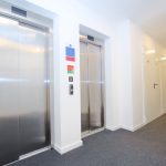 Corridor with two lifts and doors