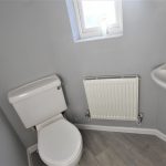 Small bathroom with sink and toilet.