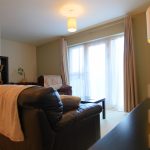 Cosy living room with sofa and natural light