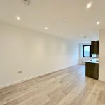 Spacious modern flat with wooden flooring.
