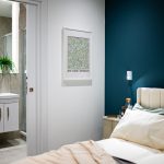 Bedroom with ensuite bathroom and modern decor.