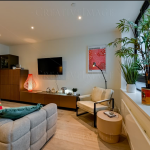 Modern living room with plants and artworks
