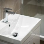 Modern bathroom sink with chrome tap