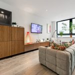 Modern living room with sofa and TV.