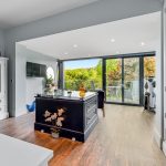 Spacious kitchen with garden view and island