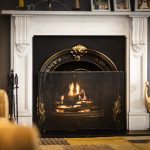 Cosy living room with burning fireplace.