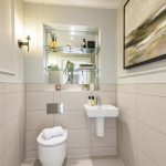 Modern bathroom with minimalistic design and artwork.
