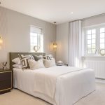 Modern bedroom with large window and stylish decor