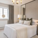 Modern bedroom with neutral colours and elegant decor.
