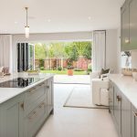 Modern kitchen with garden view and large island.