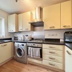 Modern kitchen with appliances and wooden floor