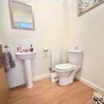 Bright bathroom with sink and toilet