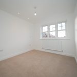 Empty room with carpet and window