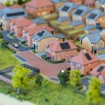 Model of a residential housing estate with greenery.