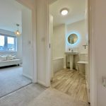 Modern bathroom and sitting area with natural light.