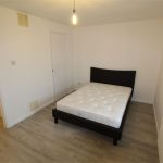 Minimalist bedroom with bed and window