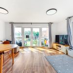 Bright modern living room with large window view.