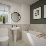 Modern bathroom with bathtub, toilet, and wall art.