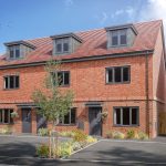 Modern brick townhouse with parking and garden.