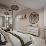 Modern bedroom with mirrored wardrobe and desk.