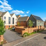 Modern suburban houses under blue sky