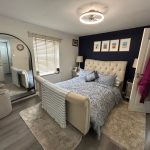 Cosy bedroom with elegant blue and white decor.